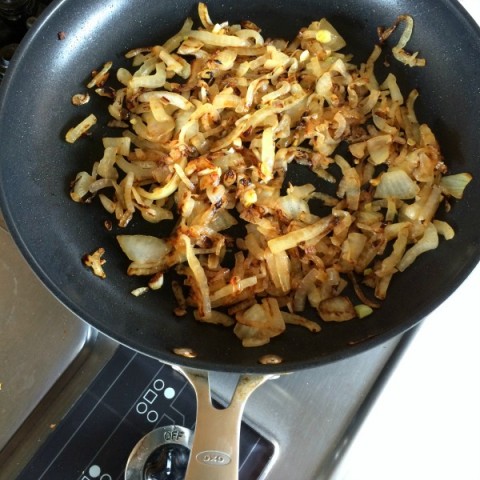 Onions caramelizing for Cheddar and Onion Cracker Pie on ShockinglyDelicious.com