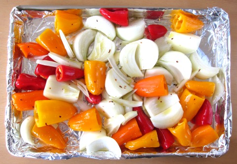 Onions, peppers and garlic ready for the oven on ShockinglyDelicious.com