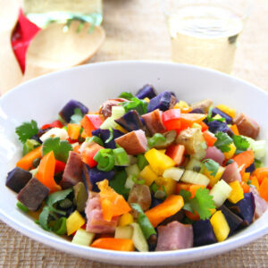 Multicolored No-Mayo Grilled Rainbow Potato Salad in a white bowl