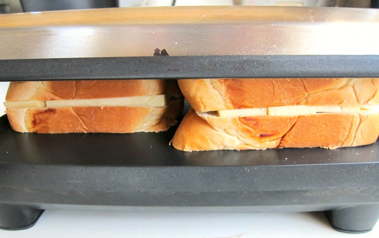 2 sandwiches in the panini maker on ShockinglyDelicious.com