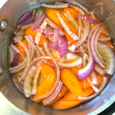 Quick Mexican Pickled Onions and Carrots soaking in brine on ShockinglyDelicious.com