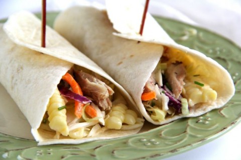 Chicken and a side of cole slaw sleep together cozily in a tortilla, for a zesty Chicken Cole Slaw Wrap perfect for lunch or dinner | ShockinglyDelicious.com 