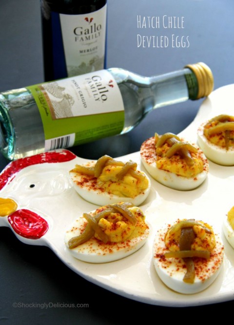 Little football-shaped Hatch Chile Deviled Eggs make great tailgating food. Easy recipe on ShockinglyDelicious.com