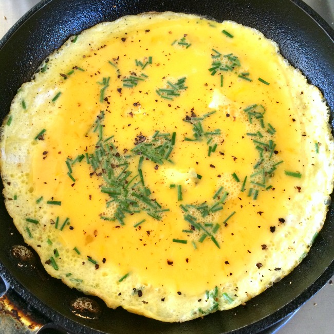 Eggs and chives in the skillet on ShockinglyDelicious.com