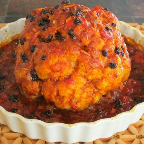 Vegetarian Whole Roasted Cauliflower in Spicy-Sweet Mexican Sauce on ShockinglyDelicious.com