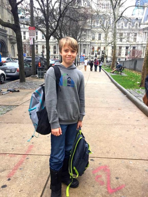 Luke hands out backpacks in Philadelphia