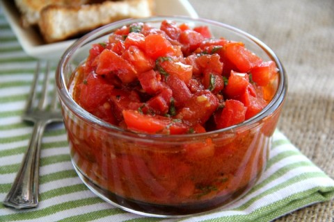 Copycat version of Trader Joe's Bruschetta Sauce is better than the original! Chopped Roma tomatoes, aromatics, evoo and balsamic vinegar is all you need to make the best Bruschetta Sauce ever, for on top of appetizer toasts, hot or cold pasta, cooked fish or even your scrambled eggs. | ShockinglyDelicious.com