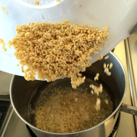 Dumping barley in the pot for the Barley Banana Berry Breakfast Bowl on ShockinglyDelicious.com