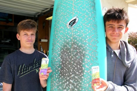 Surfing son and his friend with protein snacks on ShockinglyDelicious.com