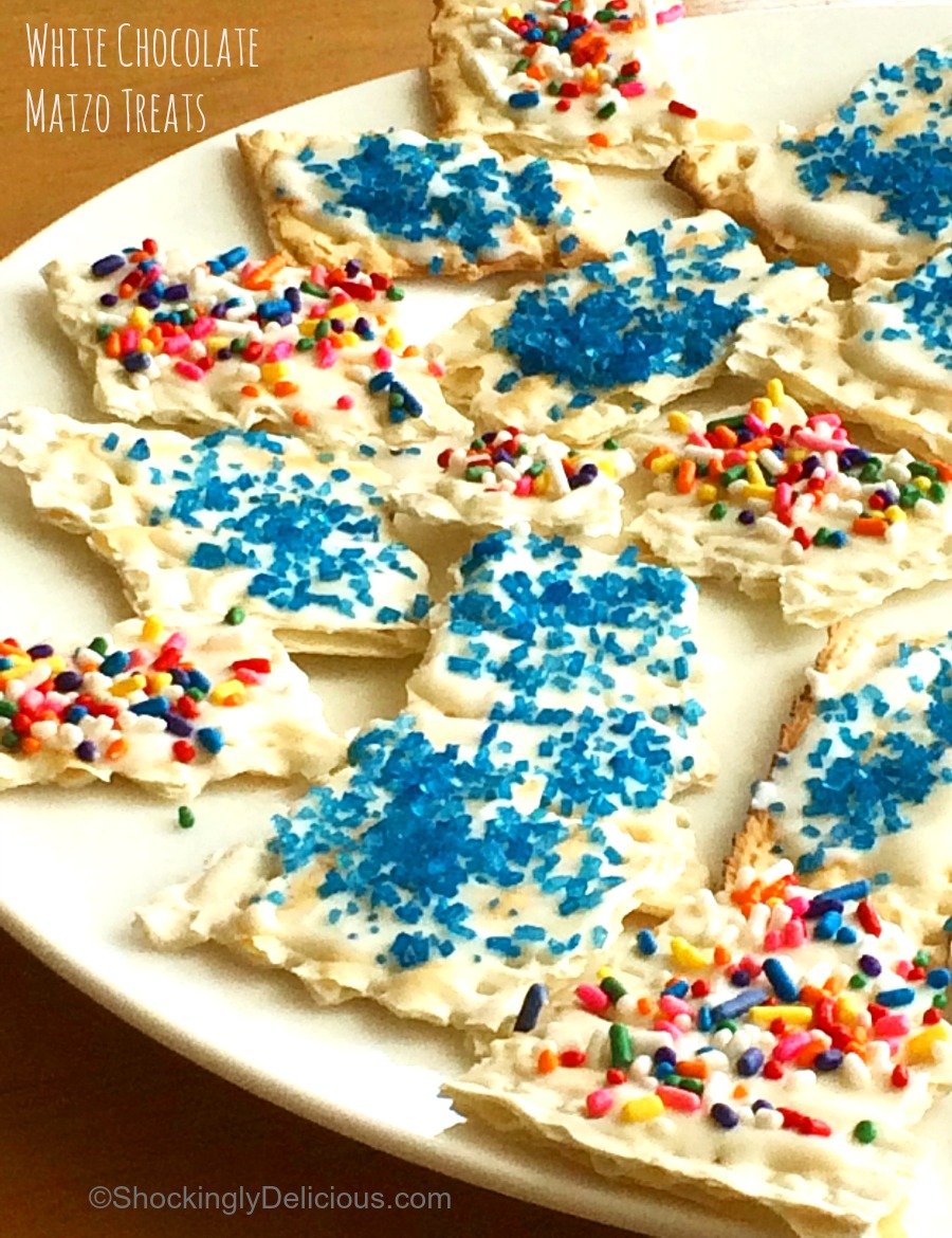 3-ingredient White Chocolate Matzo Treats with sprinkles on top on a white plate on ShockinglyDelicious.com