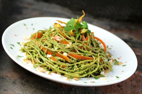 Nutritious spaghetti noodles made from edamame get dressed in a kale-cilantro pesto and topped with big flavors from coconut and ginger, for a vegetarian Edamame Spaghetti with Kale Cilantro Pesto. You can easily make it vegan, as well. | ShockinglyDelicious.com