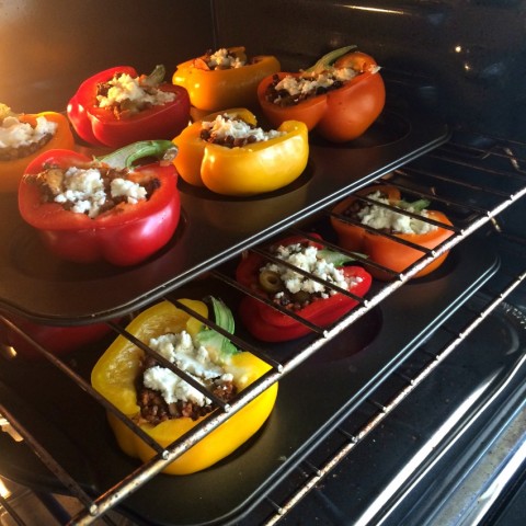 Picadillo Stuffed Peppers in the oven on ShockinglyDelicious.com