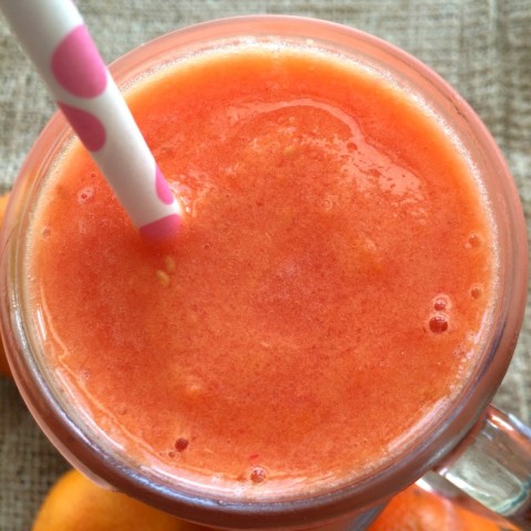 For a sweltering afternoon, tangerines, Meyer lemon juice and fresh raspberries whirl together into a frozen fruit slushy for a Tangerine Raspberry Citrus Cooler. Summer's coming! | ShockinglyDelicious.com