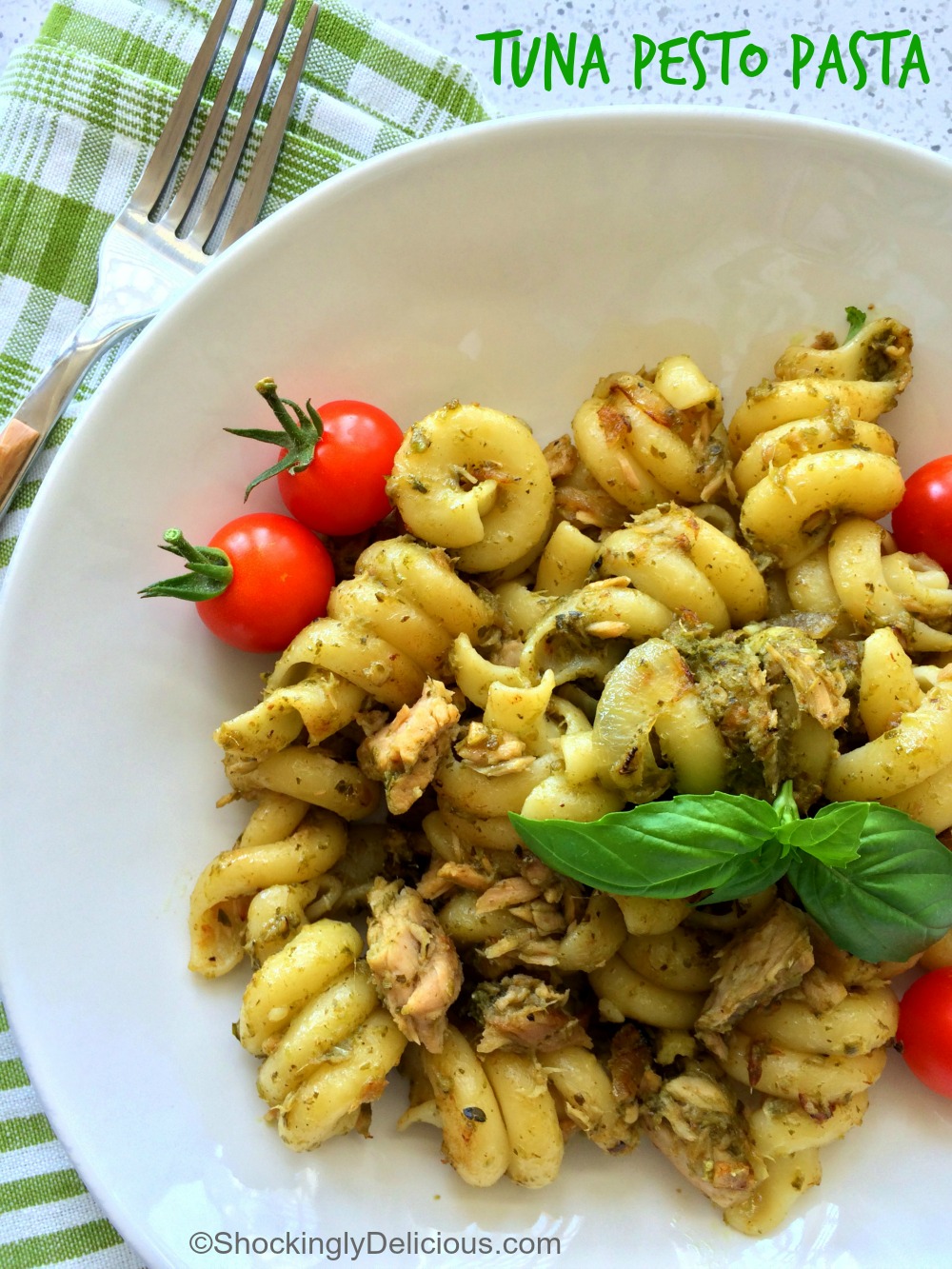 Tuna Pesto Pasta is a quick, easy yet sophisticated pantry pasta, with canned tuna and staples like pesto, garlic and onion. Ready for lunch or dinner with no grocery trip! #shockinglydelicious #pantrydinner #pestopasta #cannedtuna Tuna Pesto Pasta from the Pantry recipe title superimposed over the picture of the dish on ShockinglyDelicious.com