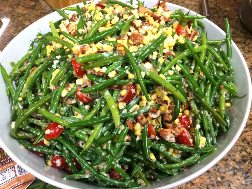 fresh-green-bean-salad-by-rachel-hollis in a white bowl against a stone counter background