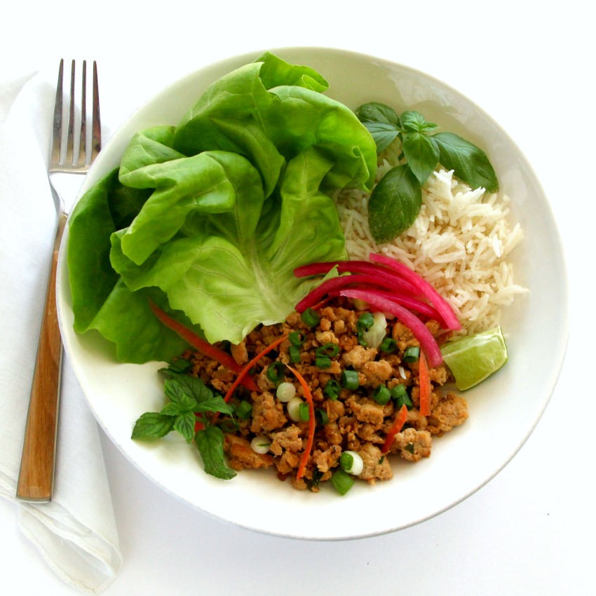 thai-inspired-turkey-lettuce-wraps in a white bowl on a white counter