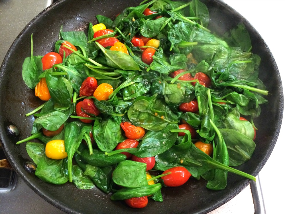 A quick three-ingredient Spinach and Cherry Tomato Saute is always welcome on the plate. Easy, fast and healthy is a great trio of attributes! 