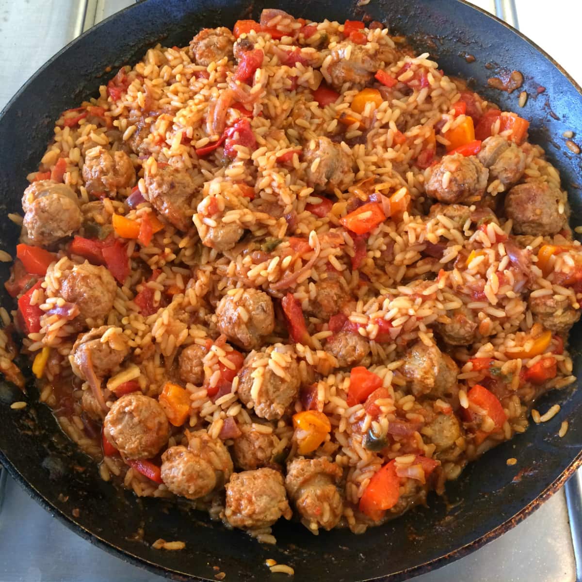 Hawaiian Jambalaya in a black skillet is ready to put in bowls