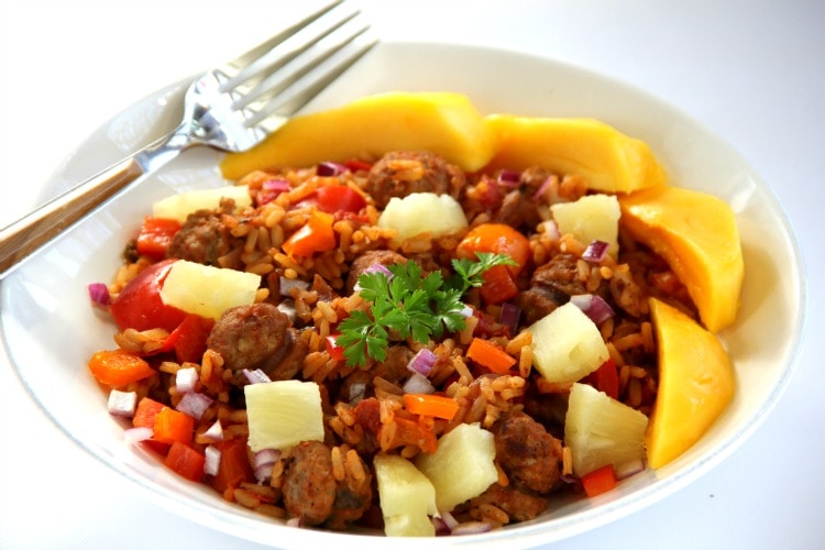 Change up classic Jambalaya with tropical fruit for a Hawaiian Jambalaya to kick off Mardi Gras or any party. Spicy rice, peppers, onions and sausage are topped by pineapple and mango. | ShockinglyDelicious.com