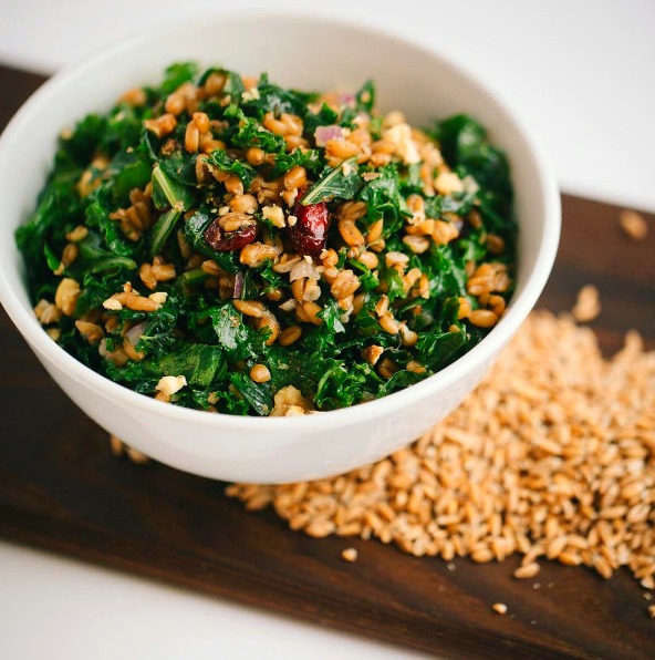 Kale and Spelt Berry Salad with Sweet Cranberries and Lemon Dressing: A masterfully balanced raw vegan kale salad with chewy spelt, sweet cranberries, crunchy walnuts harmonizing with a lemony maple dressing, from Little Eater Restaurant in Columbus, Ohio.