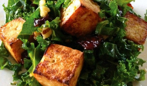 Tofu croutons -- crispy on the outside and soft and tender inside -- are a perfect counterpoint to the verdant kale salad with its sweet cherries and crunchy walnuts. An Asian-inflected dressing completes the dish.