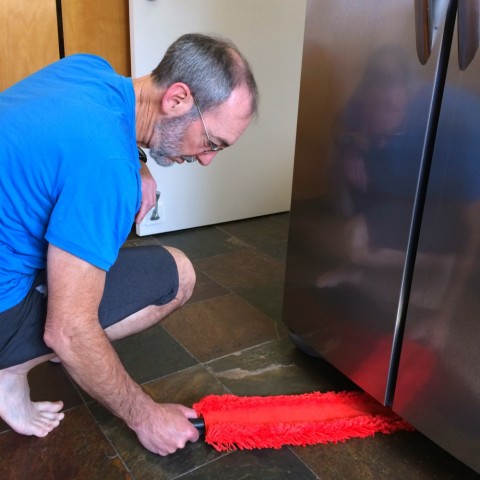 Microfiber Under Appliance Duster being used under the refrigerator