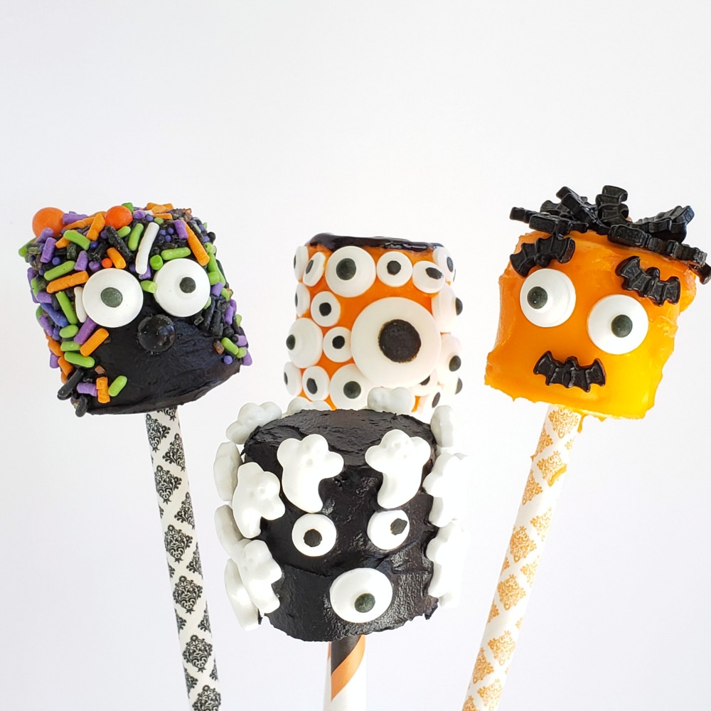 4 more decorated Monster Marshmallows stuck into patterned straws on ShockinglyDelicious.com