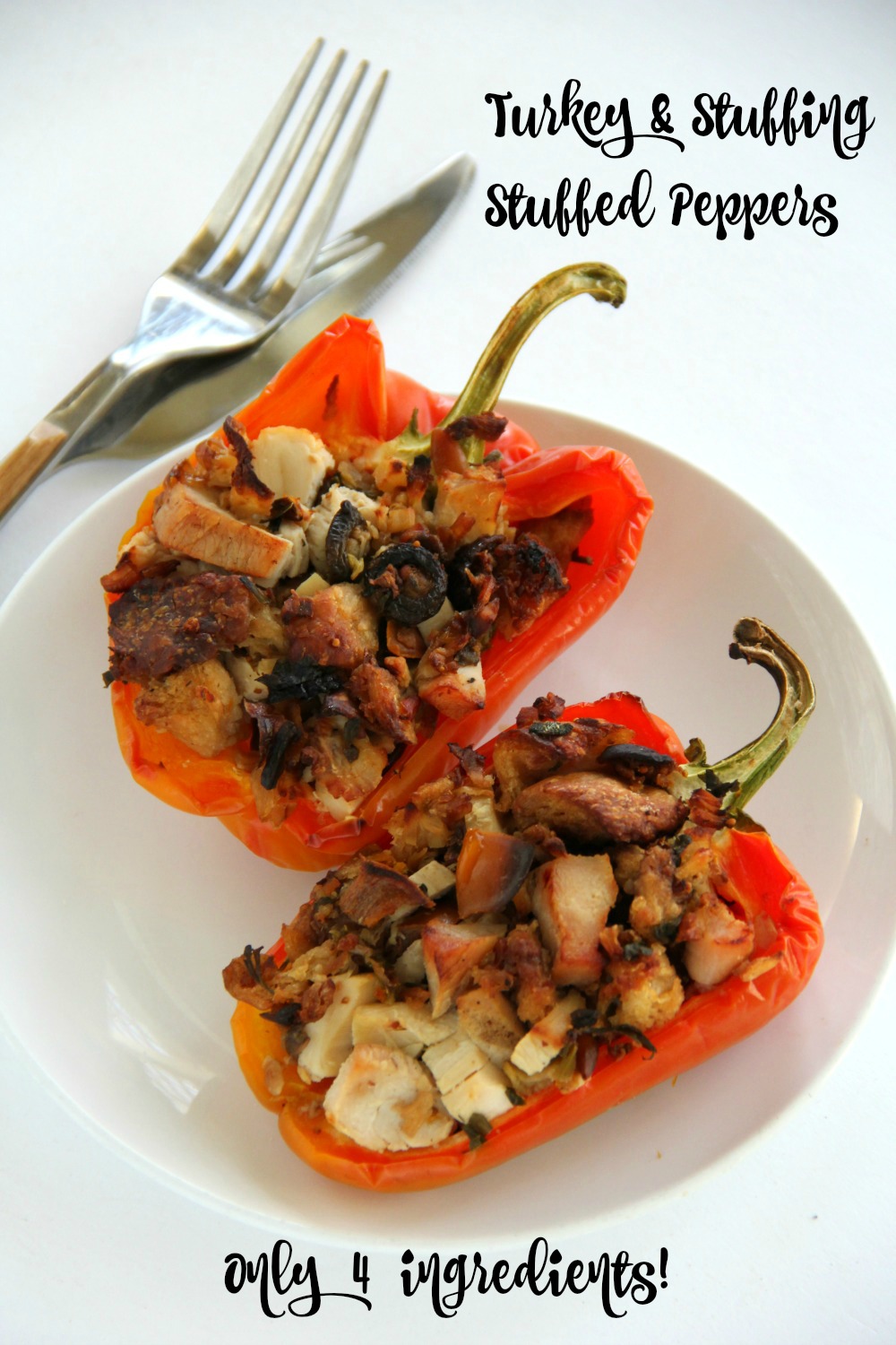 Turkey and Stuffing Stuffed Peppers on a white plate on a white background