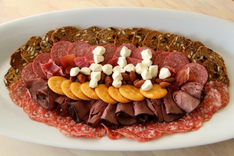 A Football-Shaped Meat and Cheese Plate might be the perfect game-day appetizer. Create it out of your favorite meats, cheeses and crackers. Touchdown!