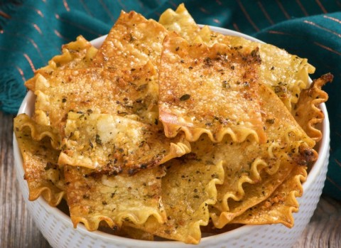 Oven-Baked Herbed Lasagna Chips: Lasagna noodles are transformed into tasty, herby, cheesy chips for snacking in this easy recipe.