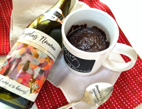 Mug brownie with red Beaujolais Nouveau wine in a white mug