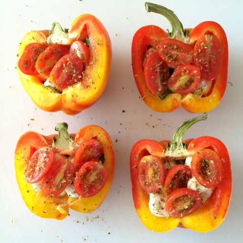 Striped Enjoya peppers cut in half with herb seasoning on top