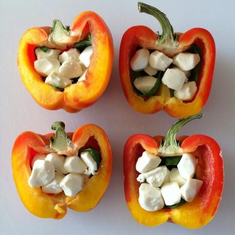 Striped Enjoya peppers cut in half with mozzarella pearls inside