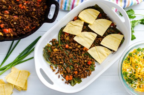 Layering tortillas in the casserole dish for Overnight Mexican Breakfast Casserole