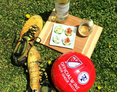 Cucumber Smoked Salmon Appetizers and wine with cleats and red soccer ball