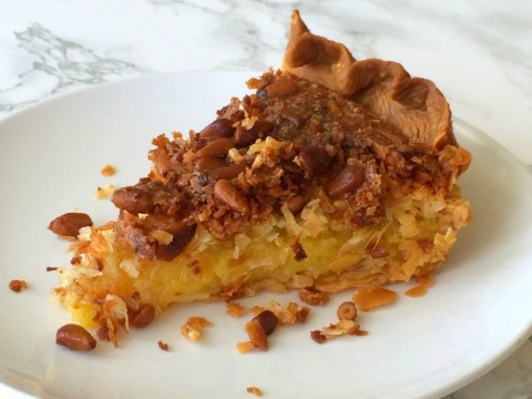 FRENCH COCONUT PIE WITH PINE NUTS: Tender coconut and toasty pine nuts baked into an egg filling perfumed with butter, vanilla, coconut and almond flavors, sparked with lemon zest. 