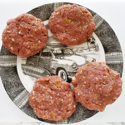 Island Pork Burgers shaped and on a surfer plate on ShockinglyDelicious.com