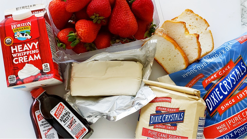 Ingredients for Strawberry Cloud Dessert on a white board on ShockinglyDelicious.com