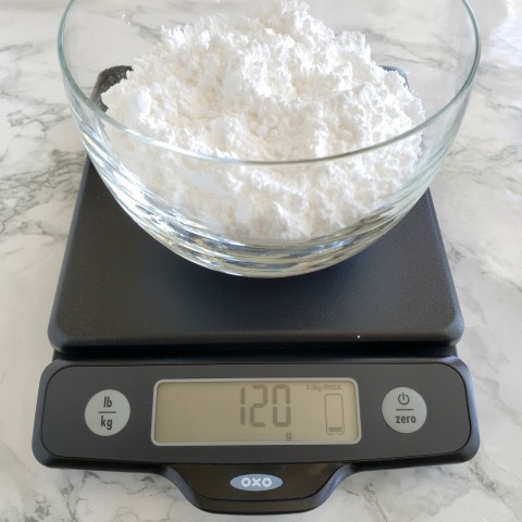 Weigh powdered sugar on the OXO scale