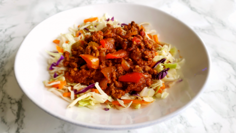 Low-Carb Instant Pot Sloppy Joes served over shredded cabbage on a white plate on ShockinglyDelicious.com