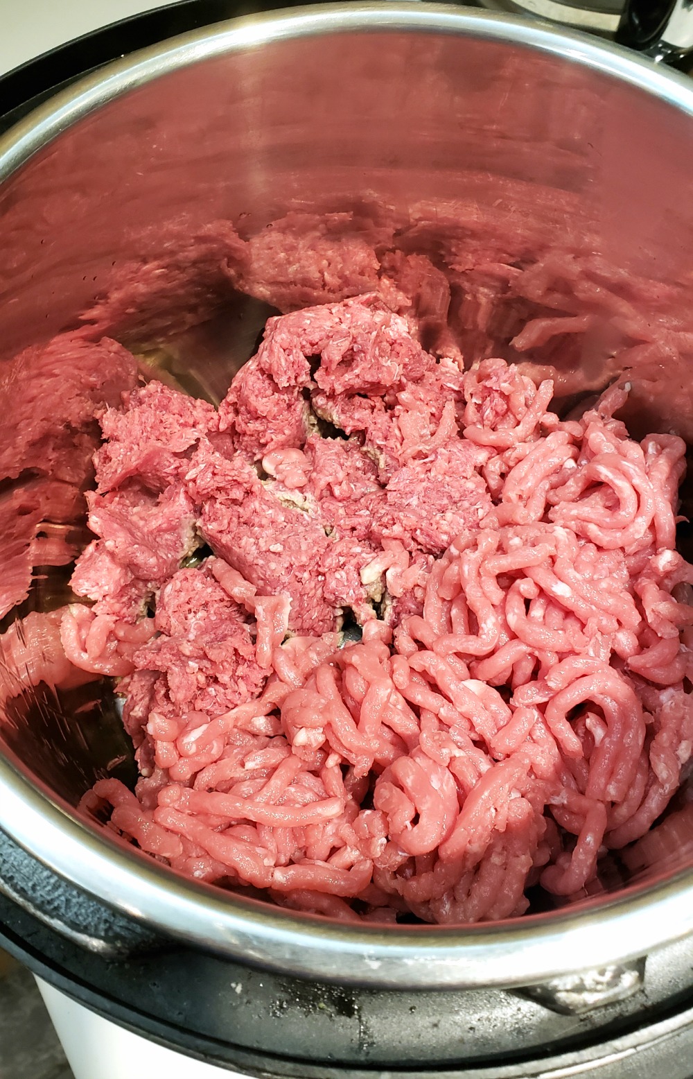 Beef and pork in the liner of an Instant Pot for Sloppy Joes