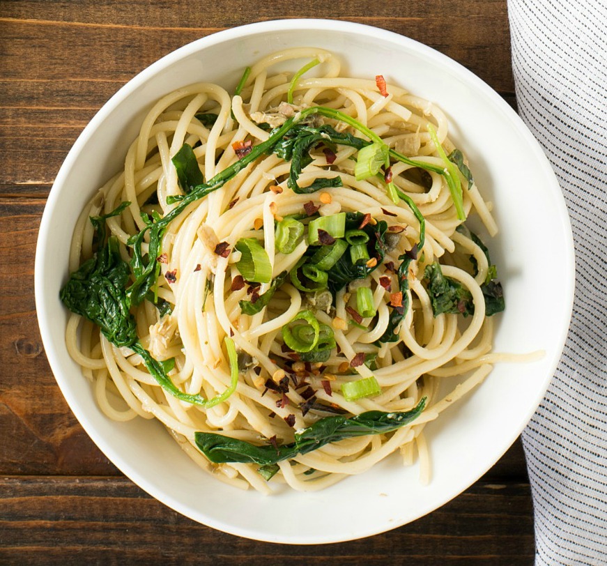Green Pasta Puttanesca is light on the pasta and amped up with plenty of flavorful healthy greens, for about 210 calories per serving. Change up what you think you know about Pasta Puttanesca by eliminating the tomato sauce and creating a green version!