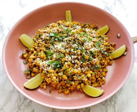 Esquites in a skillet to serve on ShockinglyDelicious.com