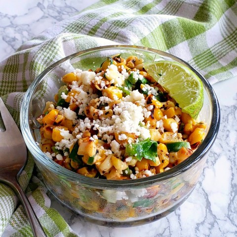 Esquites: Warm, tangy, sweet, spicy Mexican-inspired corn salad is a Mexican street snack usually sold in a cup. Holy moly it's good!