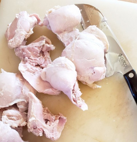 Chopping chicken for Hot Chicken Salad on ShockinglyDelicious.com
