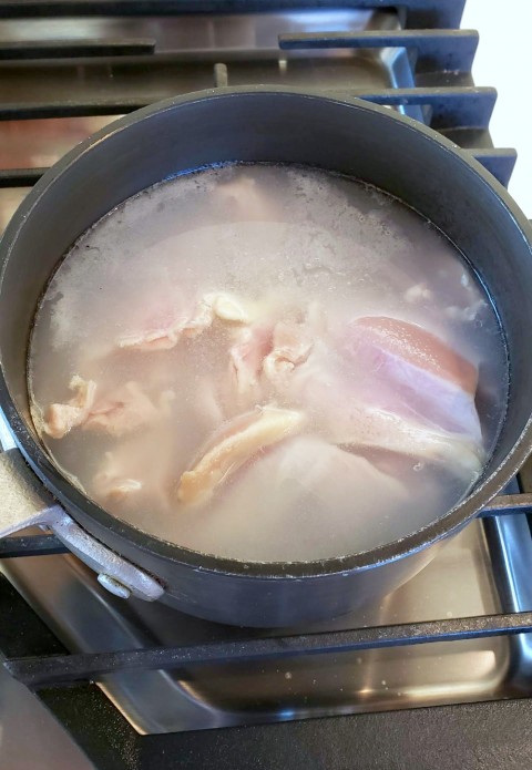 Poaching chicken thighs for Hot Chicken Salad on ShockinglyDelicious.com