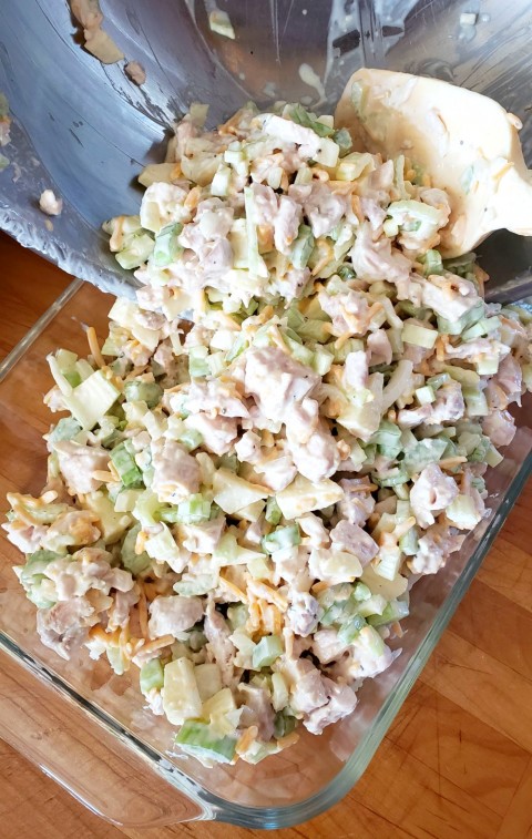 Scrape Hot Chicken Salad into a casserole dish on ShockinglyDelicious.com