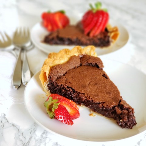 A cross between fudge and a wet brownie, this delicious blue-ribbon Old Fashioned Fudge Pie pie is a perfect foil for fresh berries or freshly whipped cream.