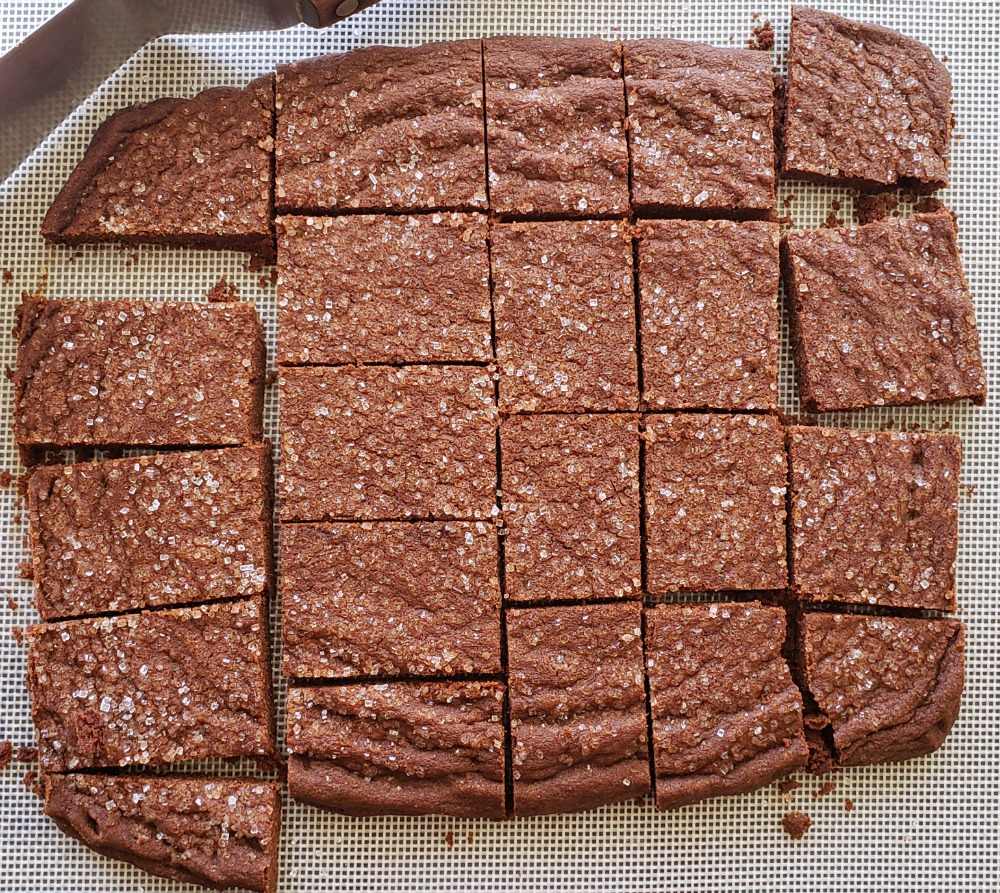 Cut Chocolate Shortbread Cookies are shown on a textured silicone baking sheet on ShockinglyDelicious.com