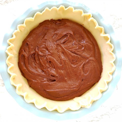 Spread batter in pie shell for Old Fashioned Fudge Pie on ShockinglyDelicious.com